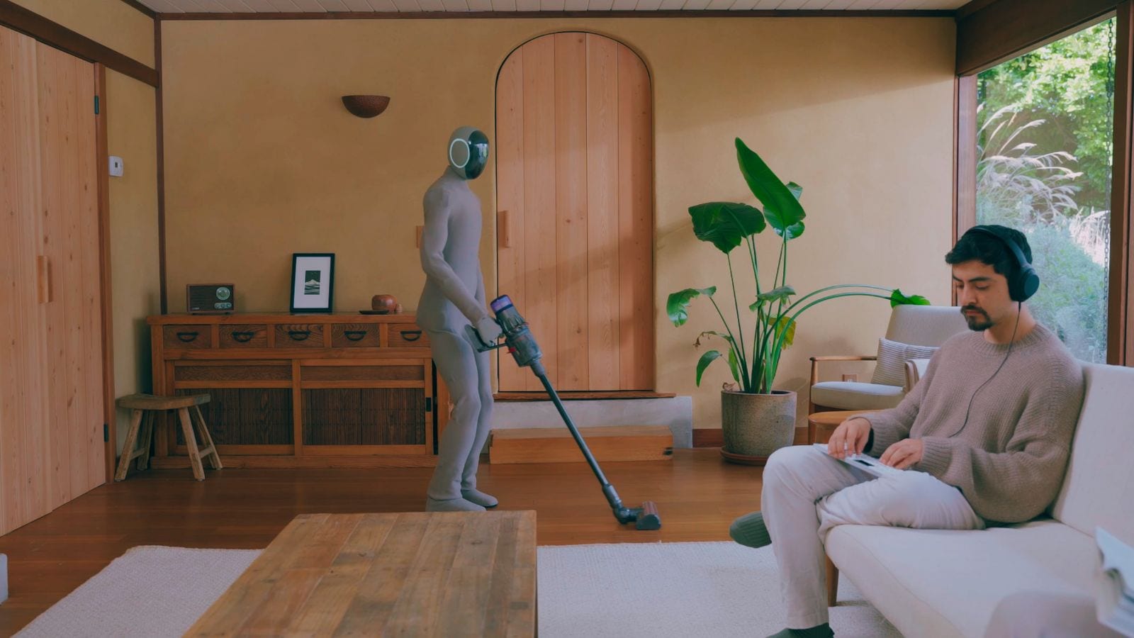 1X Neo doing chores inside a room
